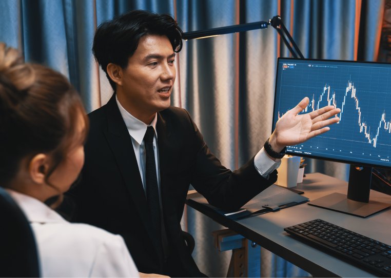 A businessman presenting the data to a woman