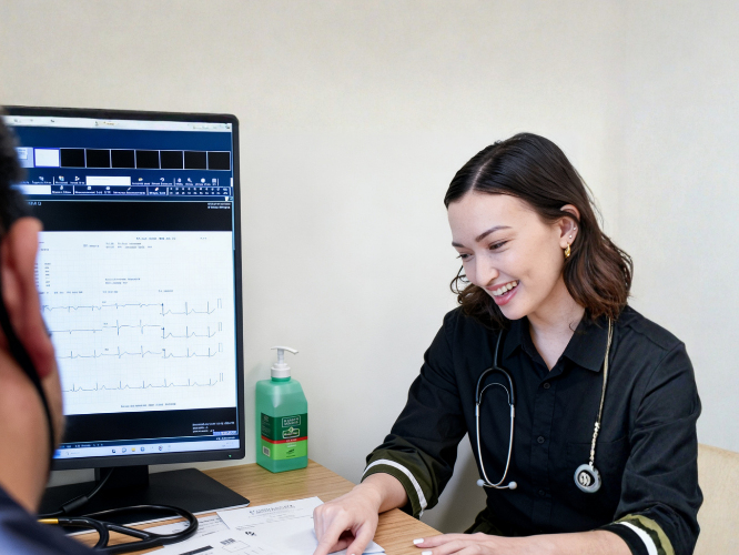 A patient smiling at the doctor's results