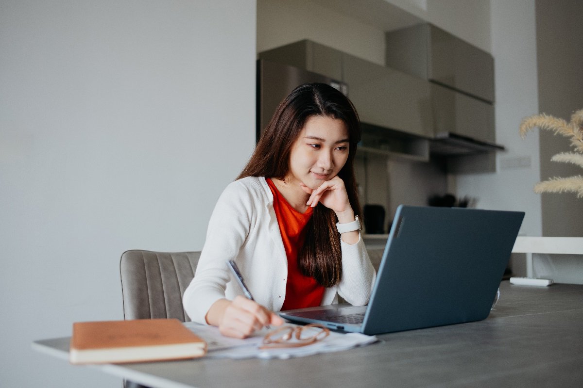 young-asian-woman-using-laptop-and-working-at-home