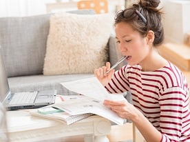 A lady looking a document