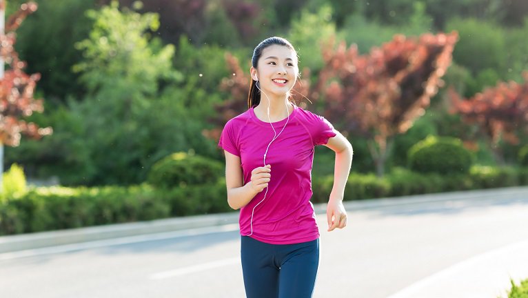 sport woman with mp3 player listening to music