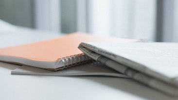 notebook and newspaper