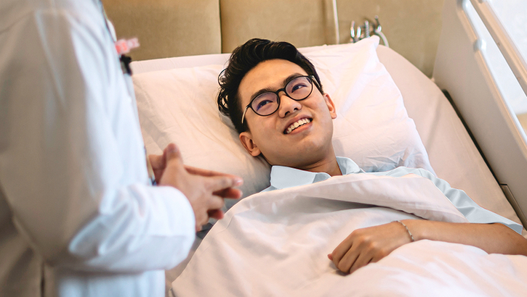 Young man recovering in bed