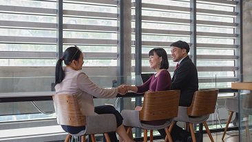 three people having discussion