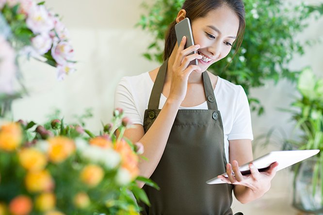Woman in apron on phone call