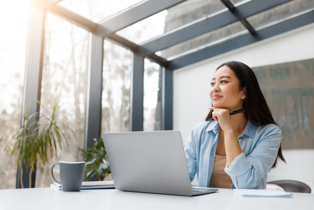 a smiling woman thinking something