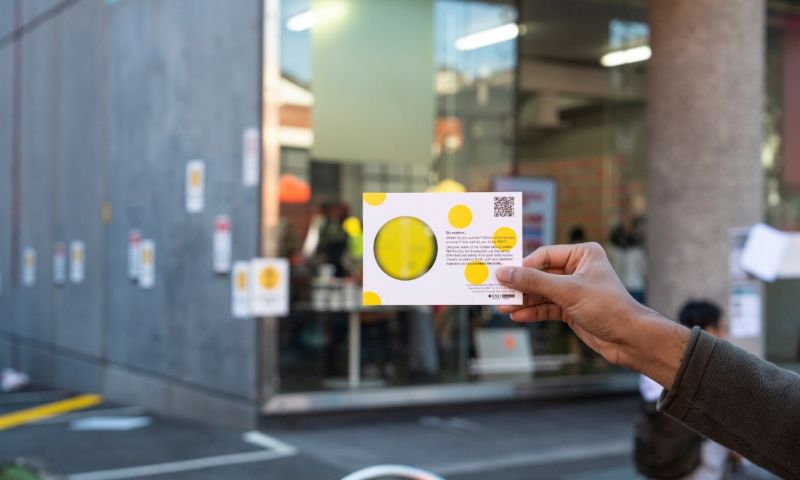 Person holding up card