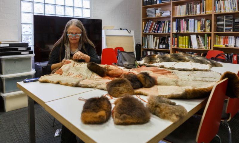 Dr Vicki Couzens, prominent Indigenous artist and RMIT researcher, stitching a blanket