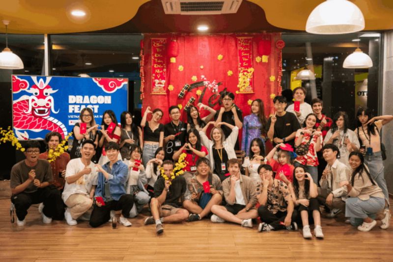 A group of people posing for a photo in a room.