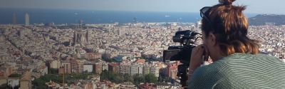 Student filming Barcelona from above