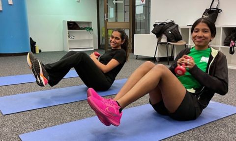 Student using an exercise machine at the Active Hub