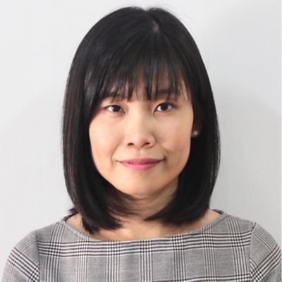 a headshot of a woman smiling 