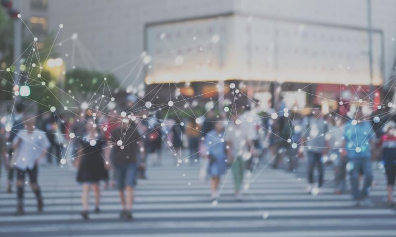 people crossing the road with a network pattern overlayed