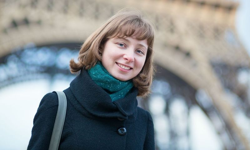 Happy beautiful tourist in Paris