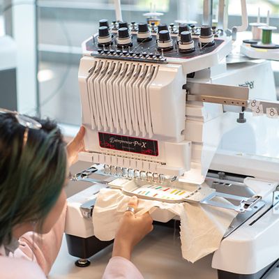 student using sewing machine