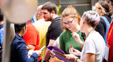 Students mingle outside at the City Campus.