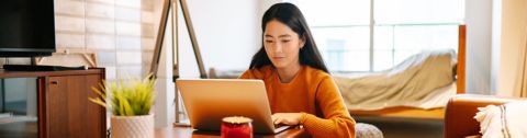 female-student-on-laptop-at-home-1440x376.jpg