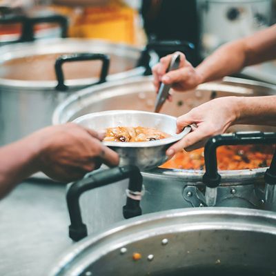 Feeding the poor to hands of a beggar, feeding food for beggar poverty concept