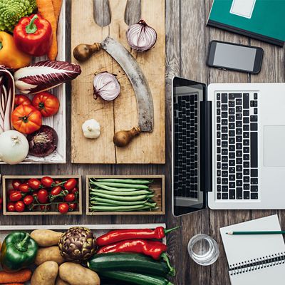 A pantry with vegetables on the left and electronic devices on the right