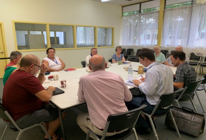 Staff sitting around a table