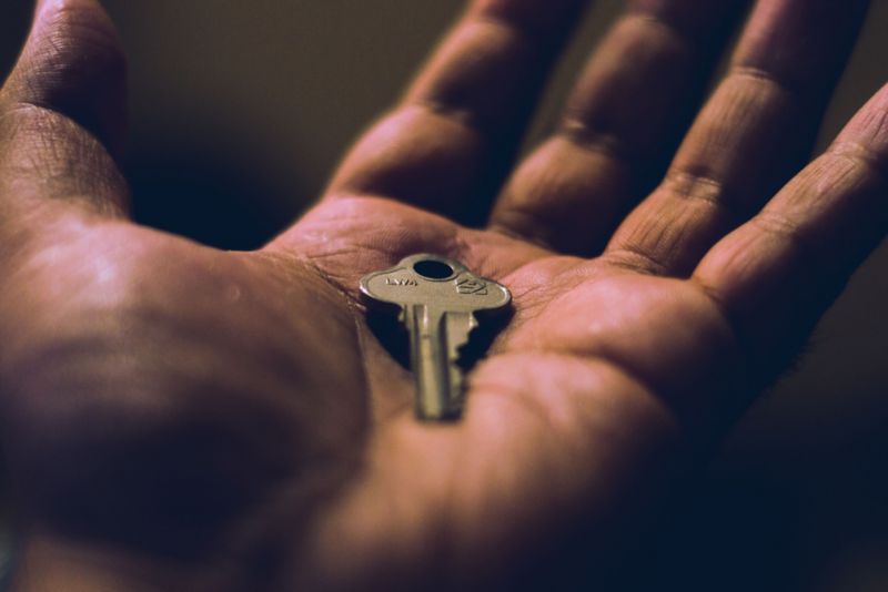 Close up of a key in a hand