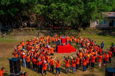 happy-bitis-community-event-with-volunteers-in-orange-shirts.jpg