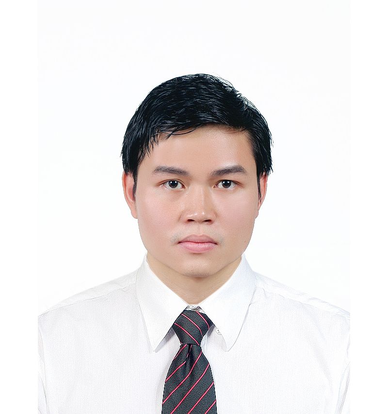 a headshot of an asian man in suit  