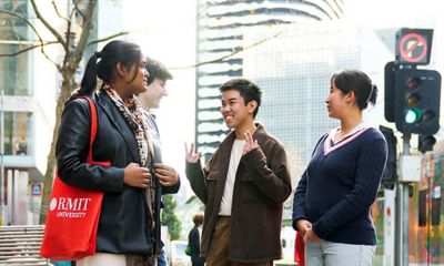 Four students from different cultural backgrounds engaged in conversation