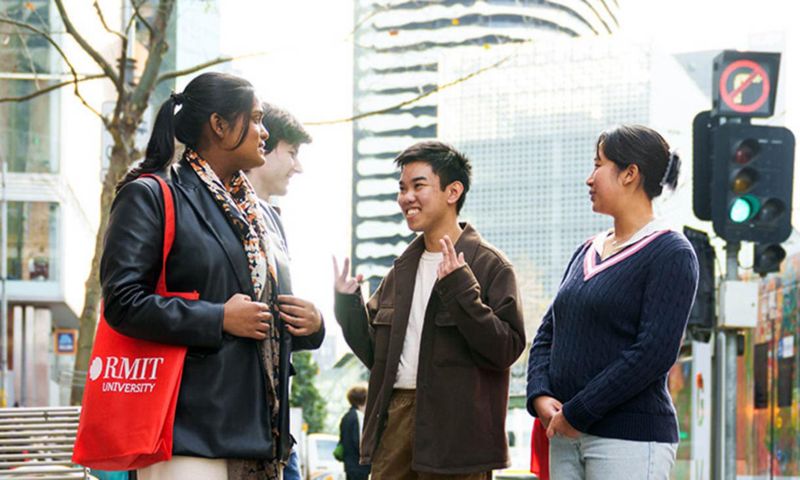 Four students from different cultural backgrounds engaged in conversation
