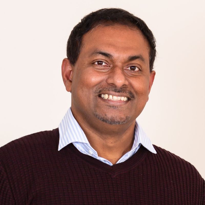 Kandeepan Sithamparnathan profile photo he is wearing a sweater and smiling