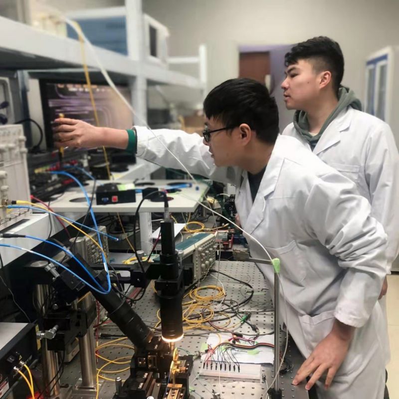 Mr. Xu Han (right) and Mr. Yongheng Jiang (left) working in the lab