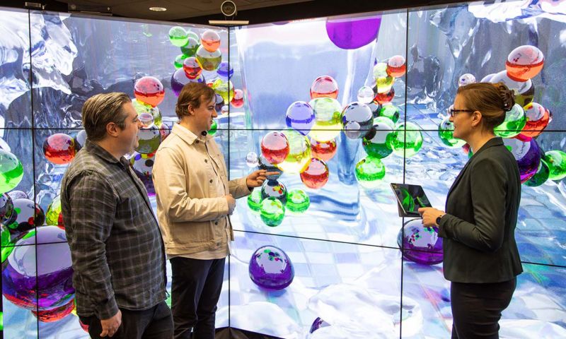 RMIT researchers Dr Michael Breedon, Dale Osborne and Professor Michelle Spencer with computer-generated animations of their molecular research.