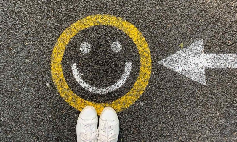 Smiley face painted on pavement