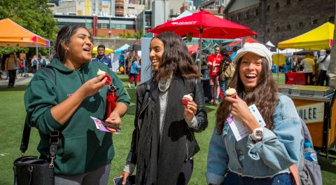 Students laugh and eat ice-cream.