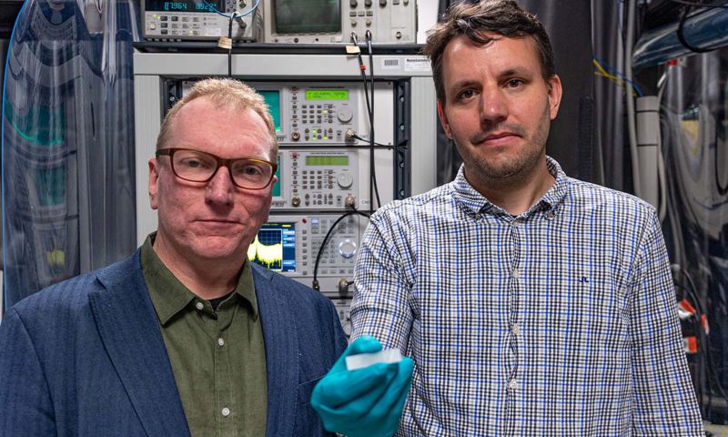 Distinguished Professor Arnan Mitchell (left) and Dr Andy Boes holding a lithium niobate chip. Credit: University of Adelaide