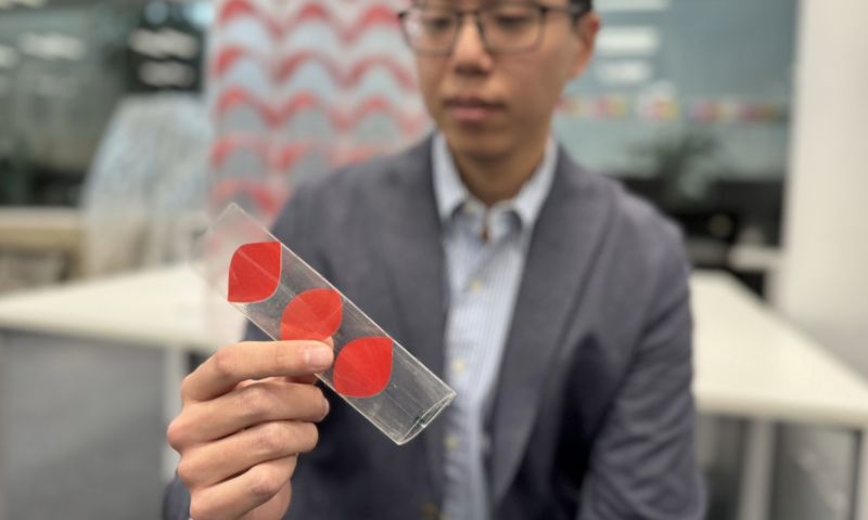 Dr Jeff Lee with a flat-pack tube. Credit: Will Wright, RMIT