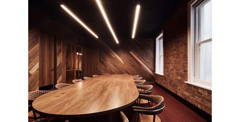Wood-panelled and exposed brick meeting room at the Oxford Scholar Hotel.
