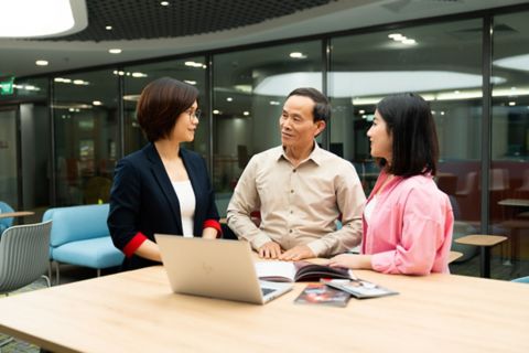 three people talking