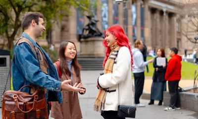 RMIT students chatting in front of the State Library of Victoria