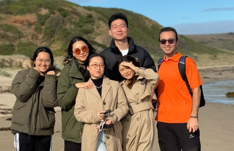 A photograph of six students ambassadors standing together on a trip to Philip Island.