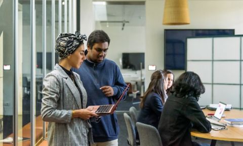 RMIT business students working on a group project together.