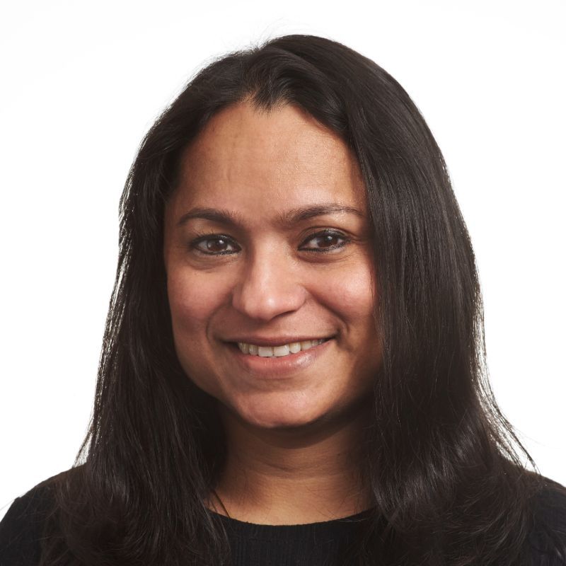Profile photo of Priya Rajagopalan smiling towards the camera against a solid white background