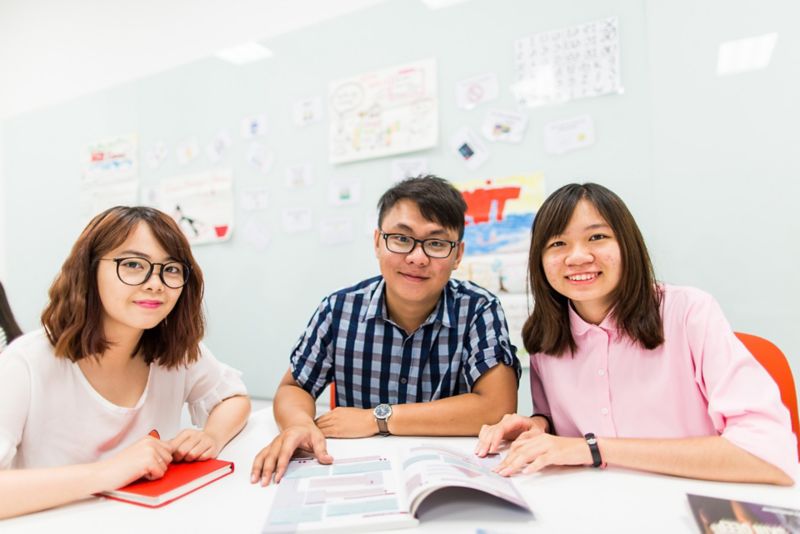 3 students smiling