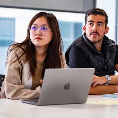two RMIT UP students in English class with laptop