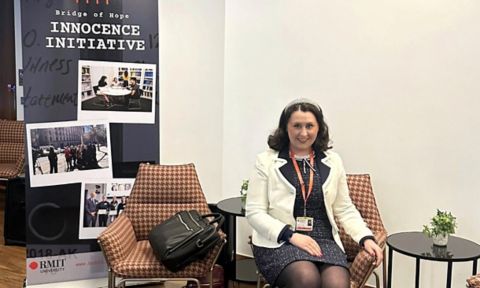 Woman sitting on chair.