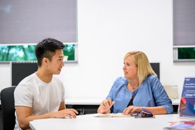 SGS. Student talking to a someone at the career centre.