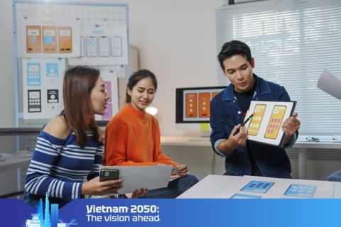 Three people discussing app designs