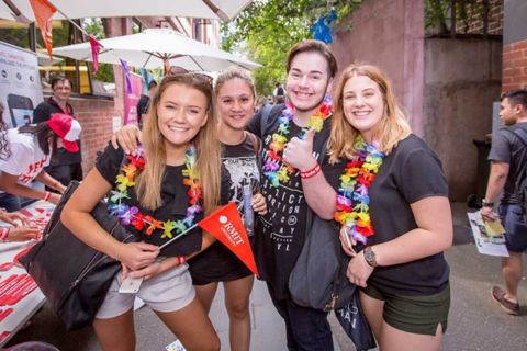 Students wear leis at an RMIT event.