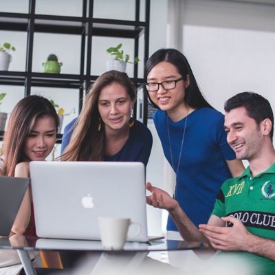 Group of students watching the laptop together