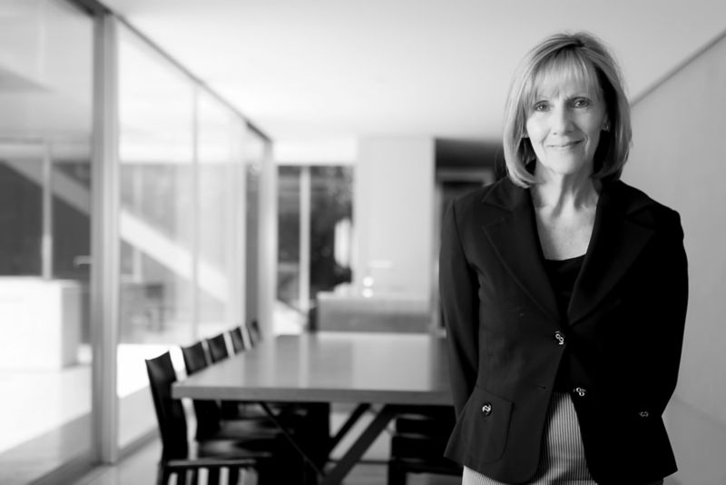 Sue Carr standing in board room